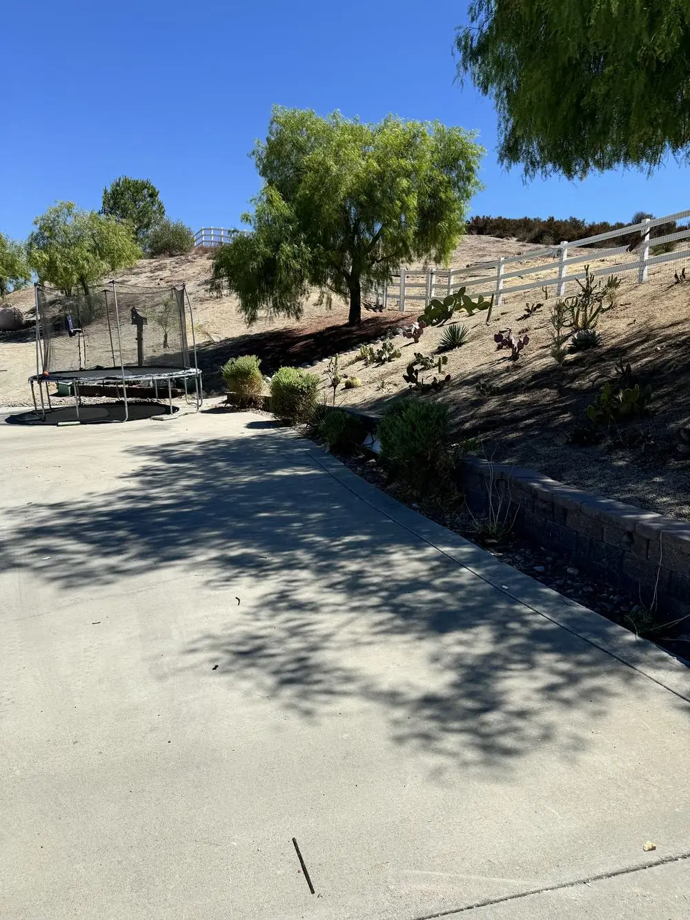 After junk removal — cleared driveway