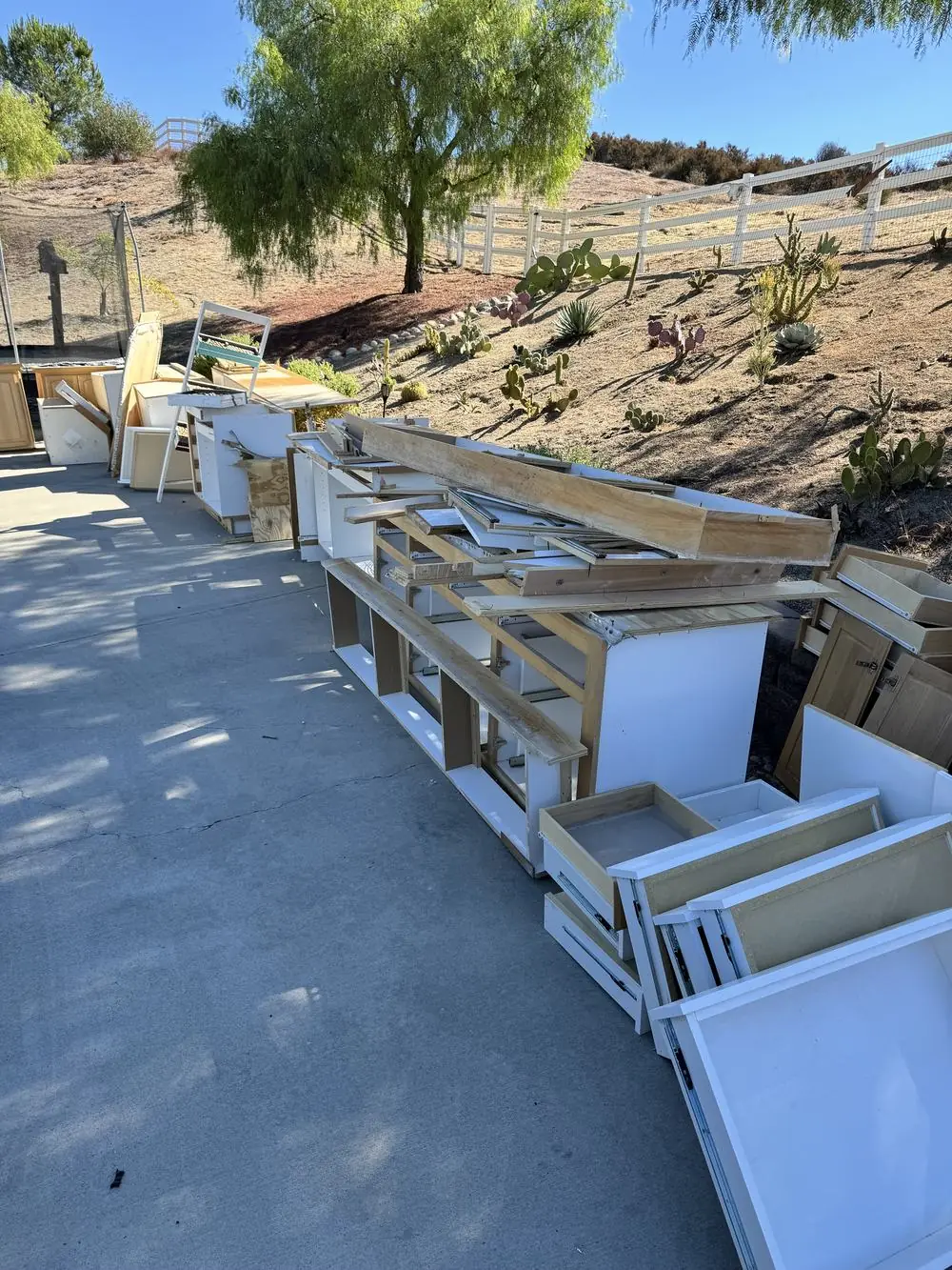 Before junk removal — driveway pile in Temecula Valley